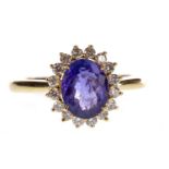 A TANZANITE AND DIAMOND CLUSTER RING