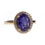 A TANZANITE AND DIAMOND RING