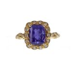 A TANZANITE AND DIAMOND RING