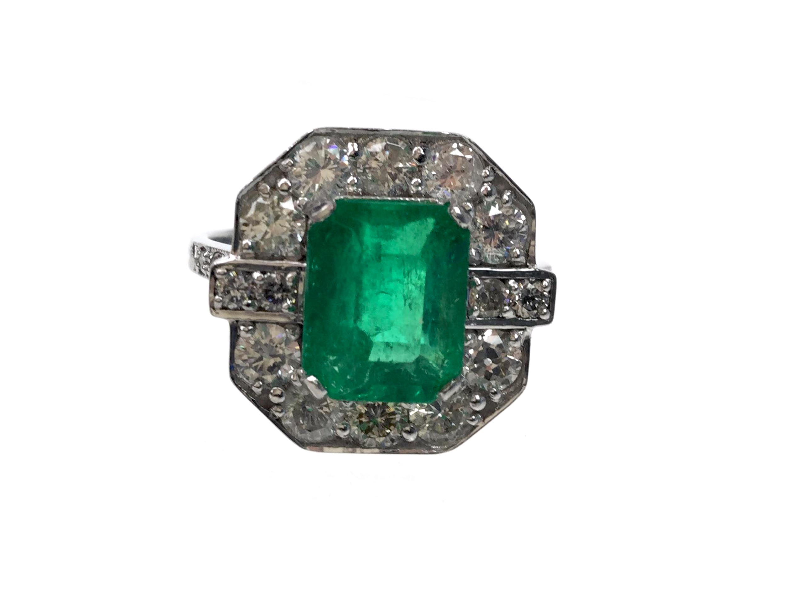 AN EMERALD AND DIAMOND RING