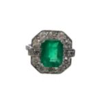 AN EMERALD AND DIAMOND RING