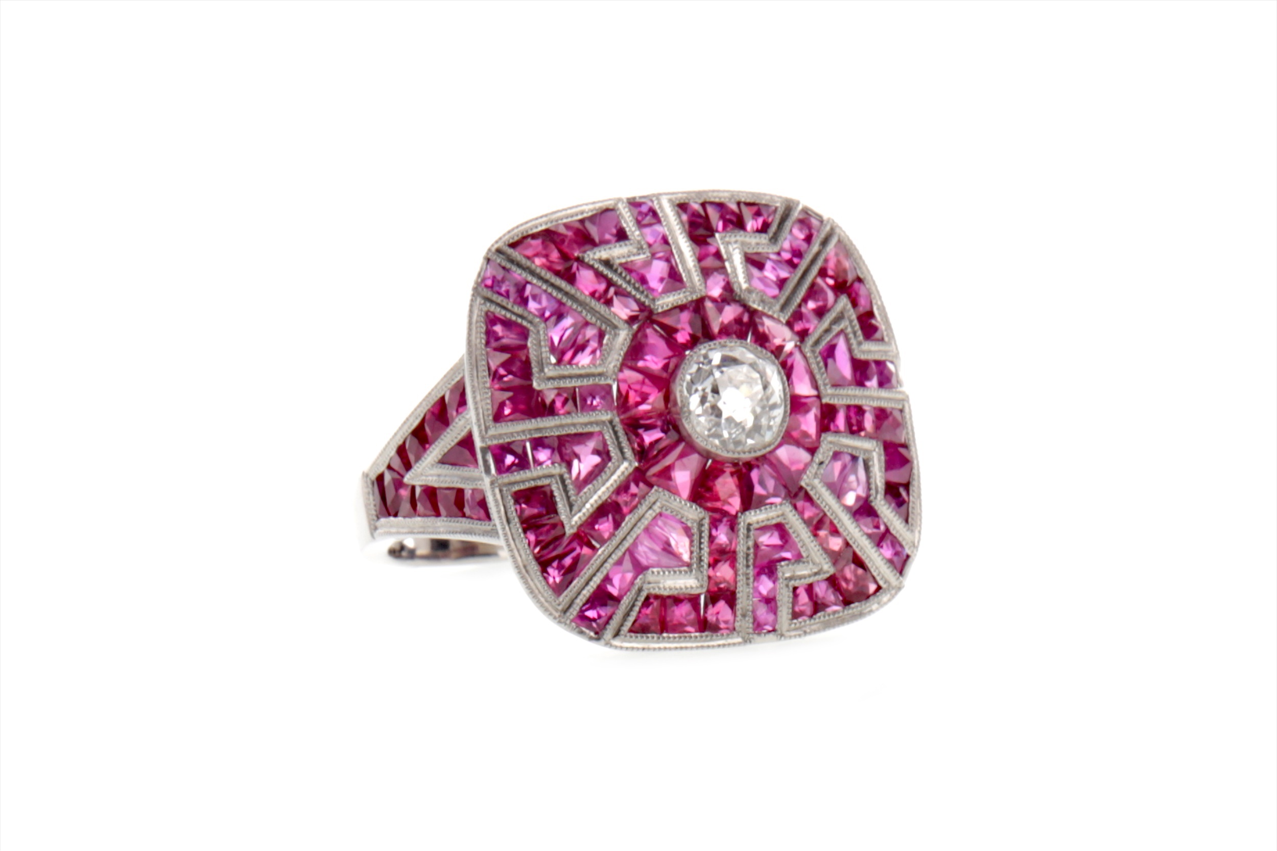 A RUBY, SPINEL AND DIAMOND AZTEC RING