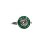 AN EMERALD AND DIAMOND TARGET RING