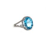 A TOPAZ AND DIAMOND RING