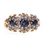 A SAPPHIRE AND DIAMOND CLUSTER RING