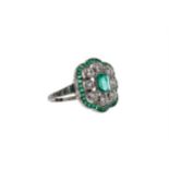 AN EMERALD AND DIAMOND RING