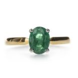 AN EMERALD SOLITAIRE RING