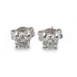 A PAIR OF DIAMOND STUD EARRINGS