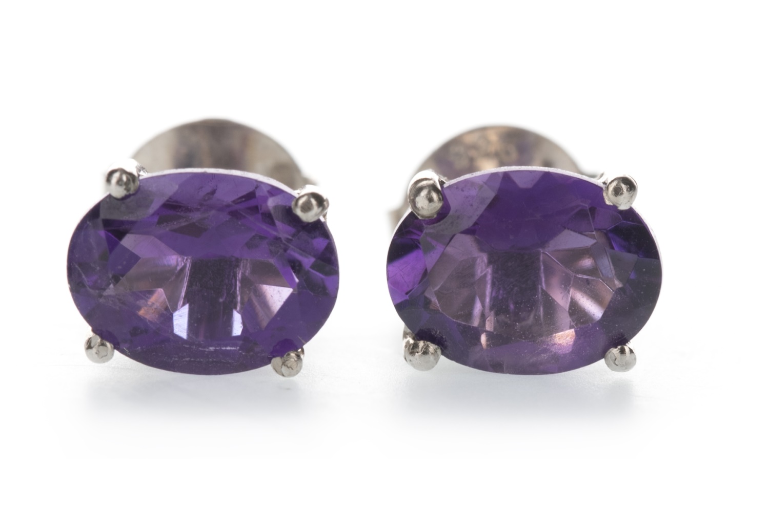 A PAIR OF AMETHYST STUD EARRINGS