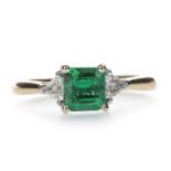 AN EMERALD AND DIAMOND RING