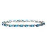 A BLUE TOPAZ AND DIAMOND BRACELET