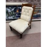 AN UPHOLSTERED NURSING CHAIR