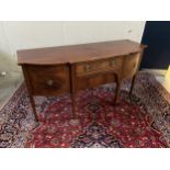 A MAHOGANY BREAKFRONT SIDEBOARD