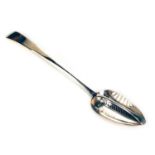 A GEORGE III IRISH SILVER SIEVE SPOON