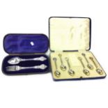 A CHRISTENING FORK AND SPOON SET AND A SET OF SIX SILVER GILT SPOONS