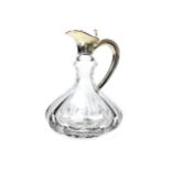 A SILVER MOUNTED CLARET JUG