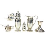 A SILVER SUGAR CASTER, A CREAMER, TWO SALTS, PEPPERETTE, MUSTARD POT, AND CANDLESTICK