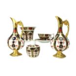 A PAIR OF ROYAL CROWN DERBY EWERS, VASES, CUP AND SAUCER