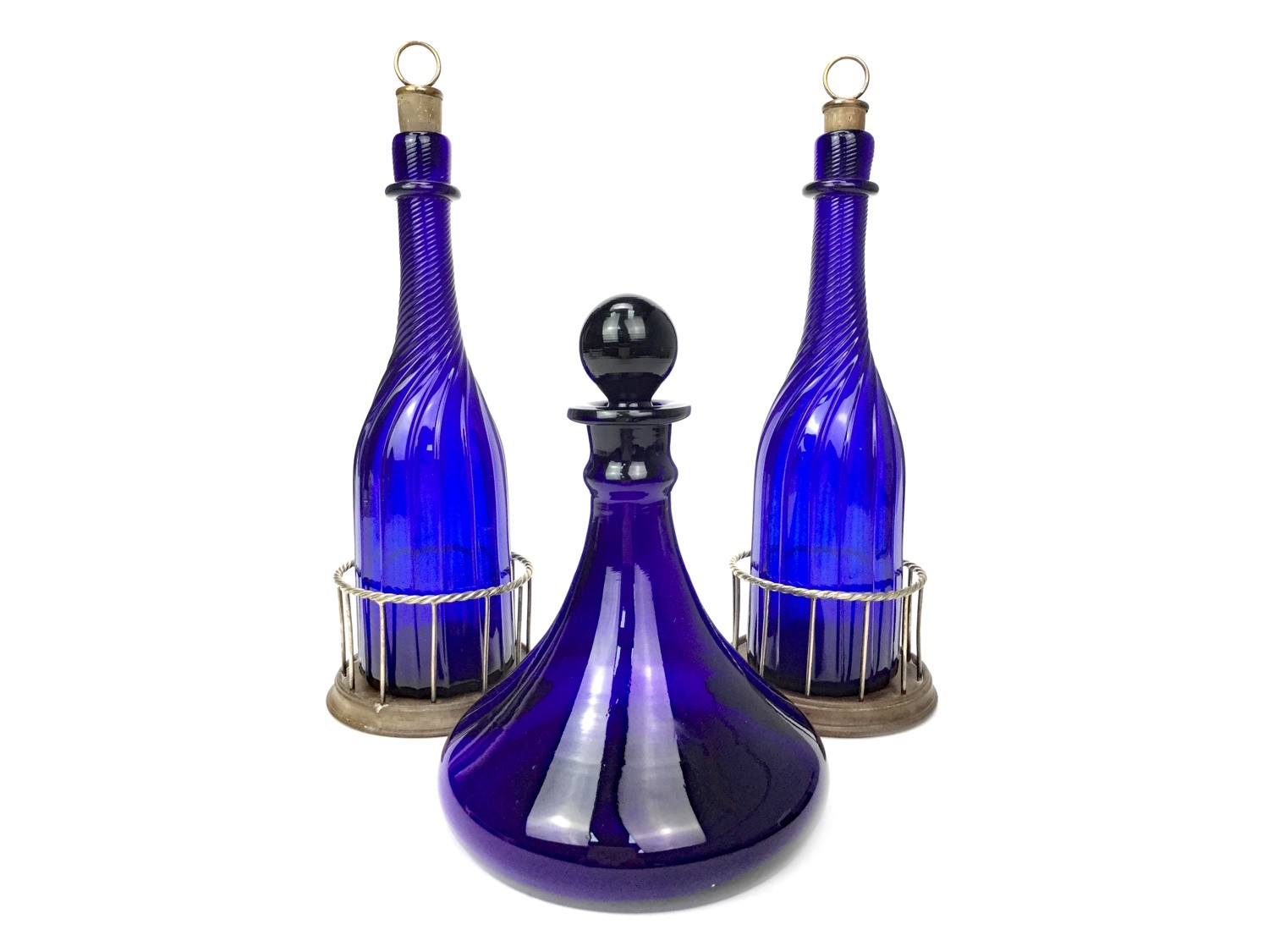 A PAIR OF WILLIAM IV BRISTOL BLUE GLASS DECANTERS AND A SHIPS DECANTER