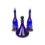 A PAIR OF WILLIAM IV BRISTOL BLUE GLASS DECANTERS AND A SHIPS DECANTER