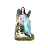 AN EARLY 20TH CENTURY CERAMIC FIGURE GROUP OF AN ANGEL AND CHRIST CHILD