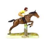 A BESWICK FIGURE OF A HORSE AND RIDER