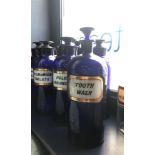 A LOT OF EARLY 20TH CENTURY BLUE GLASS PHARMACEUTICAL BOTTLES