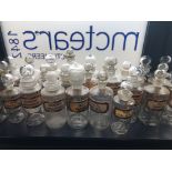 A LOT OF EARLY 20TH CENTURY CLEAR GLASS PHARMACEUTICAL BOTTLES