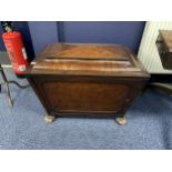 AN EARLY 19TH CENTURY MAHOGANY SARCOPHAGUS SHAPED CELLARET