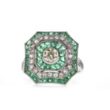 AN EMERALD AND DIAMOND RING