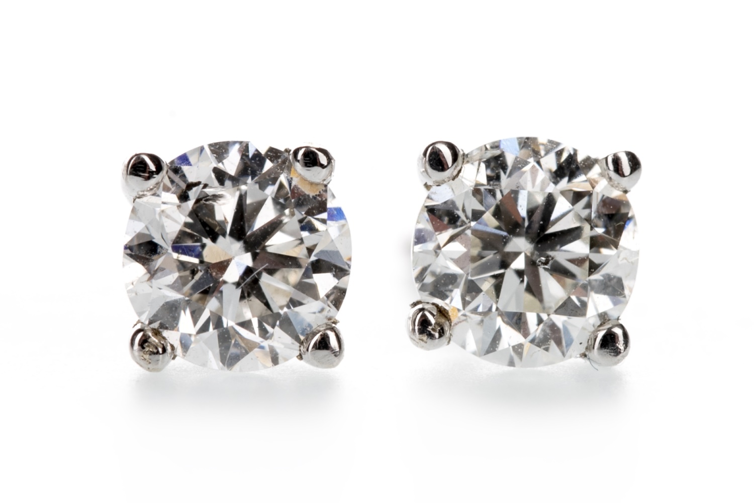 A PAIR OF DIAMOND EARRINGS