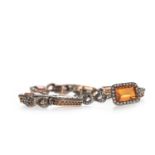 AN ORANGE GEM SET AND DIAMOND BRACELET