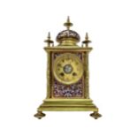 A VICTORIAN GILT METAL AND CHAMPLEVE ENAMEL MANTEL CLOCK