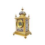 A VICTORIAN GILT METAL AND CHAMPLEVE ENAMEL MANTEL CLOCK