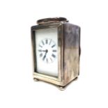 AN EARLY 20TH CENTURY SILVER CASED MINIATURE CARRIAGE CLOCK