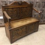 A VICTORIAN OAK HALL SETTLE