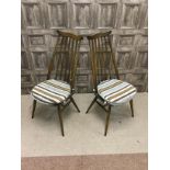 A SET OF FOUR ERCOL SPINDLE BACKED DINING CHAIRS