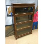 AN EARLY 20TH CENTURY OAK SECTIONAL BOOKCASE