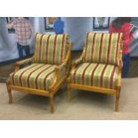 A PAIR OF WALNUT OPEN ARM CHAIRS