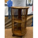 AN EDWARDIAN MAHOGANY SHERATON REVIVAL CYLINDRICAL REVOLVING BOOKCASE