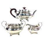 AN EARLY 20TH CENTURY SILVER THREE PIECE TEA SERVICE