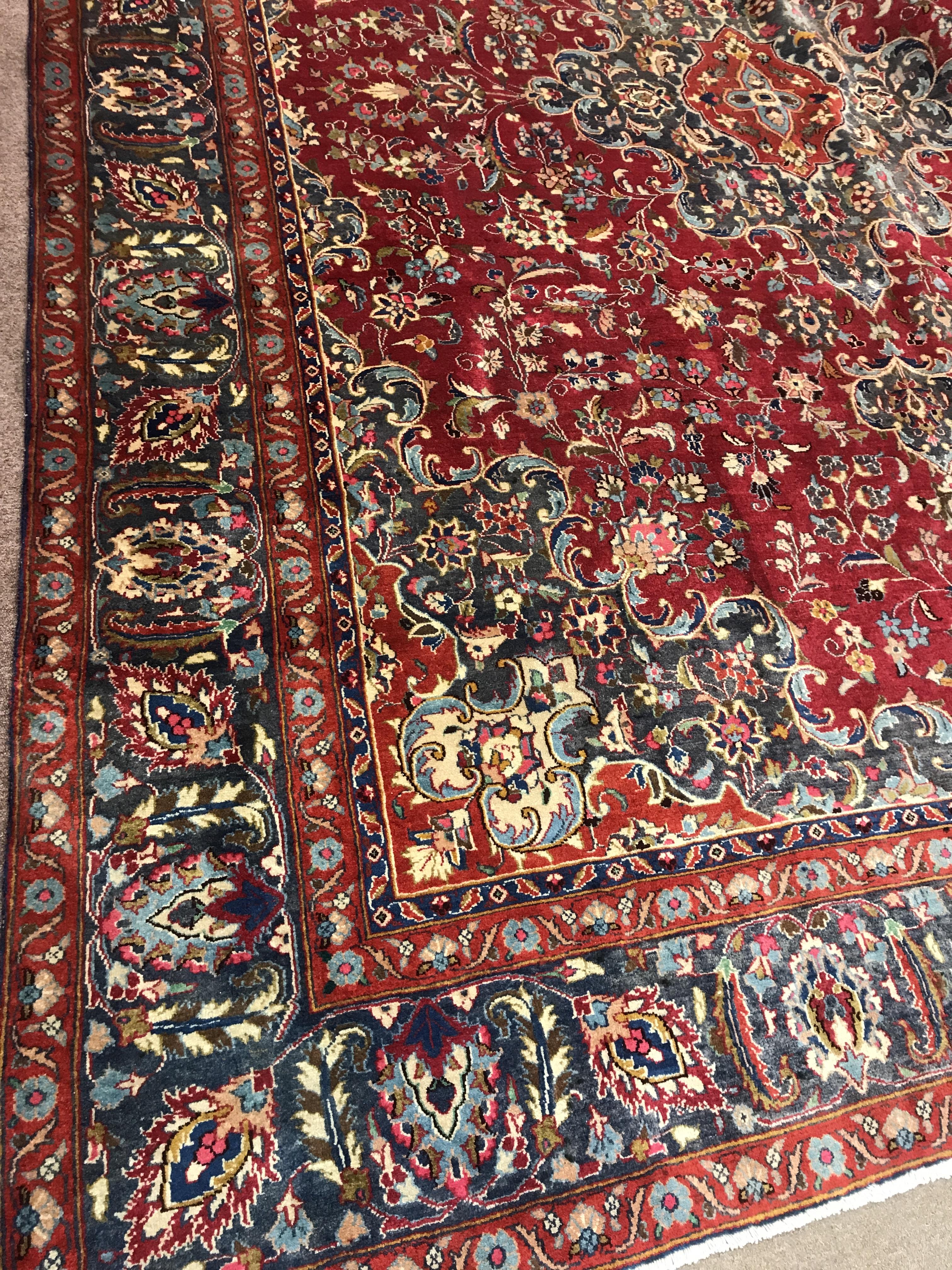 A PERSIAN MASHAD RUG