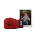 A BOXING GLOVE SIGNED BY BARRY MCGUIGAN AND A SIGNED PRINT OF THE BOXER