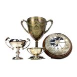 A VICTORIAN SILVER PLATED GOLFING TROPHY ALONG WITH THREE OTHERS