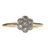 A DIAMOND DAISY CLUSTER RING