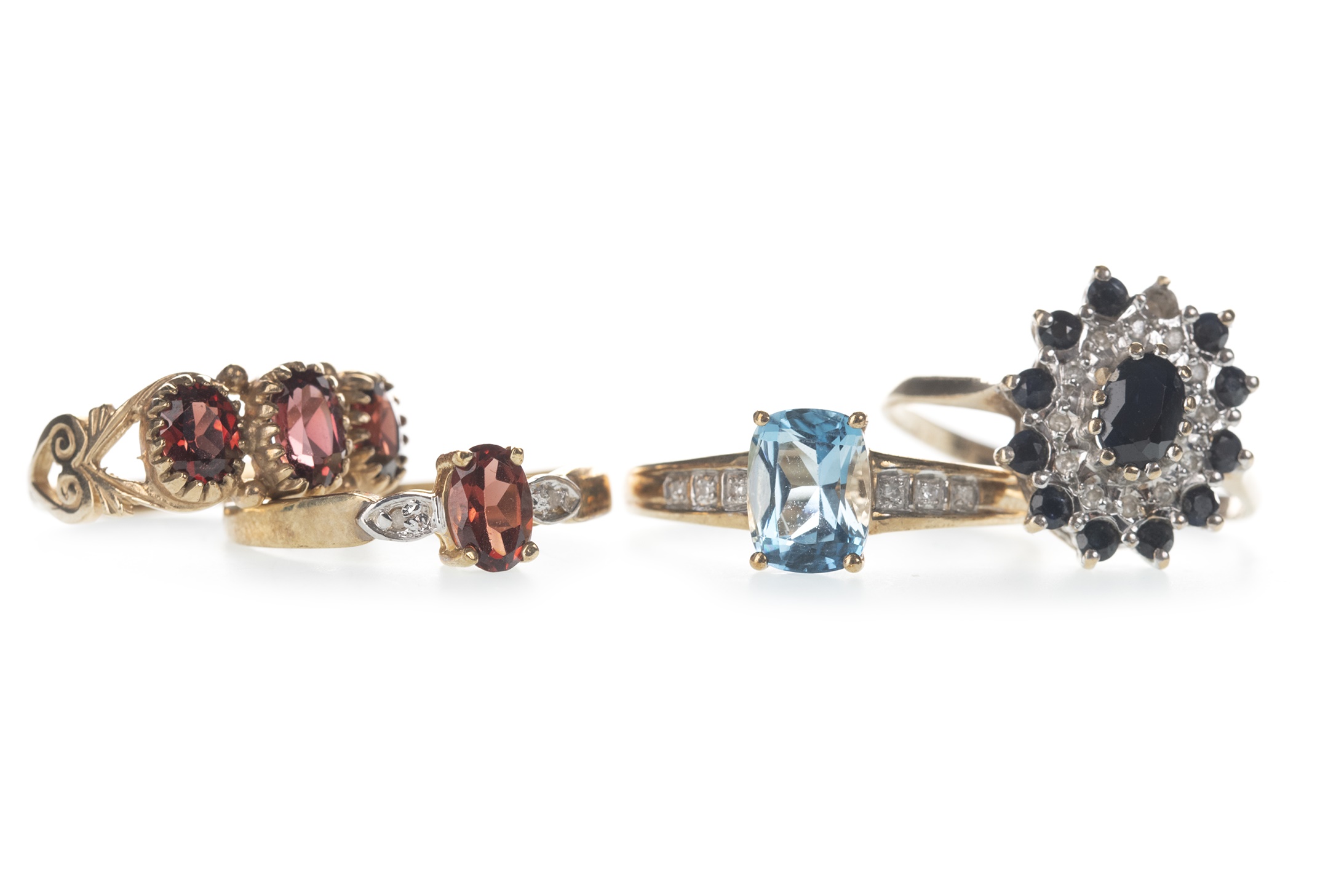 FOUR GEM SET RINGS