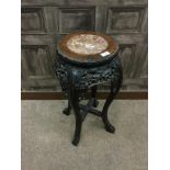 AN EARLY 20TH CENTURY CHINESE IRONWOOD PLANT TABLE