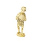 A LATE 19TH CENTURY JAPANESE IVORY CARVING OF A MAN CARRYING A SMALL KEG