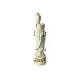 AN EARLY 20TH CENTURY CHINESE BLANC DE CHINE FIGURE OF GUAN YIN