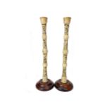 A PAIR OF EARLY 20TH CENTURY JAPANESE IVORY CANDLESTICKS